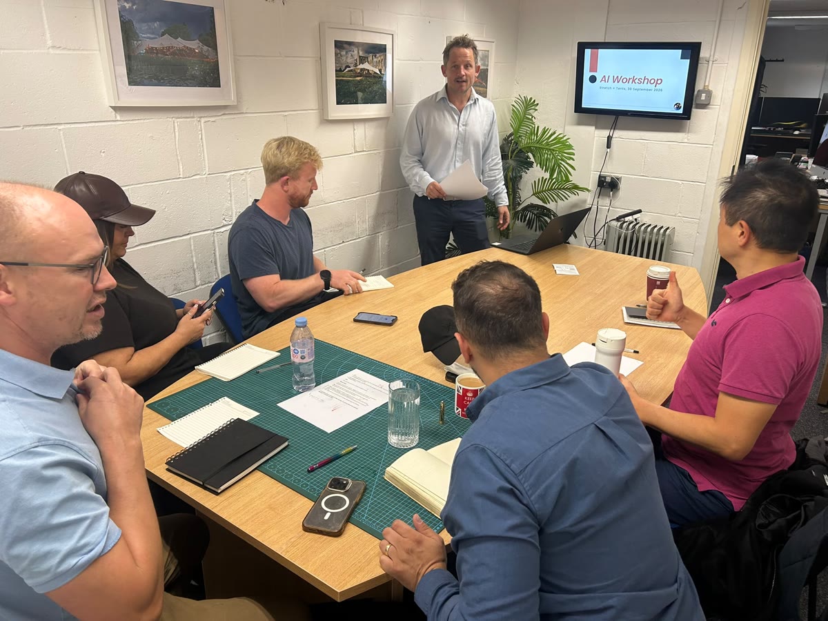Dicky running an AI workshop for a team around a meeting table